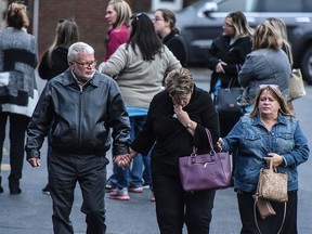 Mourners grieve after leaving a service at St. Stanislaus Roman Catholic Church for some of the victims in last weekend's fatal limo crash on October 12, 2018 in Amsterdam, New York. (Stephanie Keith/Getty Images)