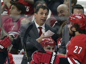 In this Sept. 19, 2018, file photo, Carolina Hurricanes coach Rod Brind'Amour speaks with his players during the first period of an NHL hockey preseason game against the Tampa Bay Lightning, in Raleigh, N.C. The Hurricanes promoted assistant Brind'Amour to replace Bill Peters when he left to coach the Calgary Flames.