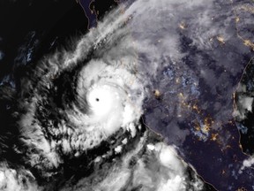 This image provided by NOAA on Monday, Oct. 22, 2018, shows Hurricane Willa in the eastern Pacific, on a path to smash into Mexico's western coast. (NOAA via AP)