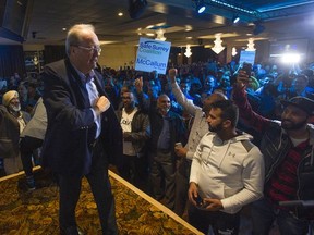 Safe Surrey Coalition mayoral candidate Doug McCallum celebrates his win in the civic election on Oct. 20.