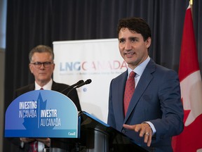 Prime Minster Justin Trudeau during a press conference announcing the signing of a Declaration of Final Investment Decision for a LNG project in Kitimat while the CEO of LNG Canada Andy Calitz looks on in Vancouver, BC, October, 2, 2018. (Richard Lam/PNG) (For ) 00054807A [PNG Merlin Archive]
