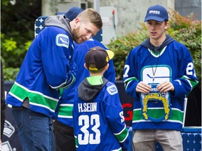 Canucks fans outside Rogers Arena on opening night against the Flames.