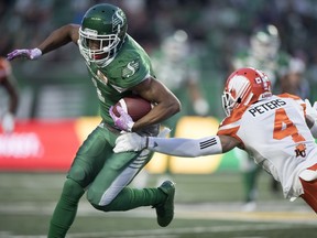 OUT OF REACH: Roughriders wide receiver Shaq Evans runs by Lions defensive back Garry Peters at Mosaic Stadium in Regina.