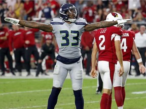 Seattle Seahawks defensive back Tedric Thompson (33) celebrates a missed field goals by Arizona Cardinals kicker Phil Dawson (4) during the second half of an NFL football game, Sunday, Sept. 30, 2018, in Glendale, Ariz. The Seahawks won 20-17.