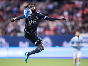 Vancouver Whitecaps' Kei Kamara jumps and receives a pass with his foot during the second half of an MLS soccer game against Sporting Kansas City in Vancouver, on Wednesday October 17, 2018.