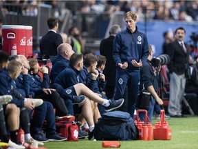 Vancouver Whitecaps' acting head coach Craig Dalrymple stands on the sideline and talks with his players during Wednesday's MLS game against Sporting Kansas City  at B.C. Place Stadium. Vancouver blew a 1-0 second-half lead and lost 4-1.