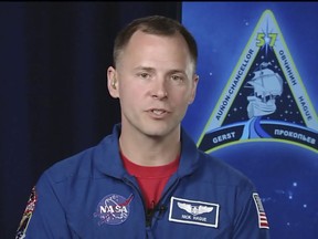 In this frame from video from NASA TV, NASA astronaut Nick Hague, who survived the Oct. 11, 2018, failed launch and emergency landing, speaks Tuesday, Oct. 16, 2018, from the NASA Johnson Space Center in Houston. (NASA TV via AP)