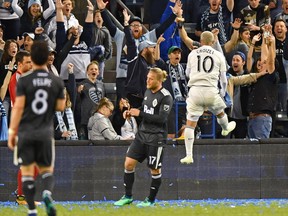 Sporting KC midfielder Yohan Croizet (10) reacts after scoring a goal against the Vancouver Whitecaps during the second half at Children's Mercy Park on Apr 20, 2018.