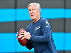 Head coach Pete Carroll of the Seattle Seahawks watches his team warm up before a November 2018 NFL game in Charlotte, N.C.