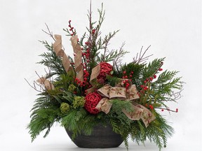 An artistic arrangement of cedar, silver fir, skimma, ilex berries and cornus twigs, complemented by colourful accent pieces, creates a stunning winter container.