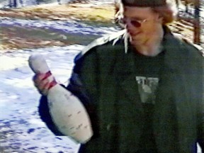 Dylan Klebold examines a bowling pin used for target practice at a makeshift shooting range on March 6, 1999, about six weeks before unleashing the worst school shooting in U.S. history at Columbine High School.