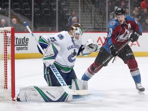 Goaltender Jacob Markstrom of the Vancouver Canucks was forced to make a great glove save against Nathan MacKinnon of the Colorado Avalanche when the two teams met in Denver last January.