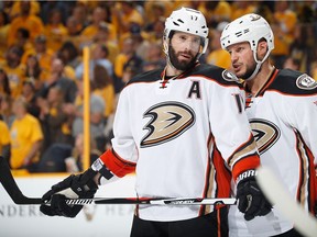 Former Canucks Ryan Kesler, left, and Kevin Bieksa talk strategy during an Anaheim Ducks' playoff game against the Predators last May in Nashville, Tenn.