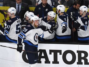 Patrik Laine of the Winnipeg Jets is congratulated by his teammates after scoring a second-period goal against the Vegas Golden Knights in Game Four of the Western Conference Finals during the 2018 NHL Stanley Cup Playoffs at T-Mobile Arena on May 18, 2018 in Las Vegas, Nevada.