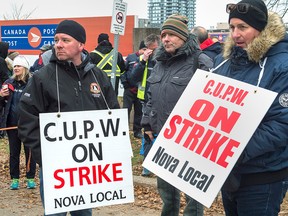 Canada Post workers walk the picket line as a rotating strike continues in Halifax last week.