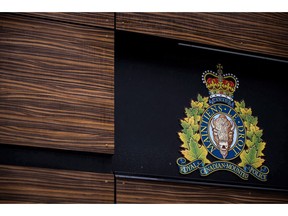 The RCMP logo is seen outside Royal Canadian Mounted Police "E" Division Headquarters, in Surrey, B.C., on April 13, 2018. Canadian companies should watch out when they use technology supplied by state-owned companies from countries that want to steal corporate secrets, the country's security agencies have warned them. The RCMP organized two workshops last March -- one in Calgary, the other in Toronto -- to raise awareness about threats to critical systems, including espionage and foreign interference, cyberattacks, terrorism and sabotage, newly disclosed documents show. Canadian Security Intelligence Service materials prepared for the workshops advise that "non-likeminded countries," state-owned enterprises and affiliated companies are engaged in a global pursuit of technology and know-how driven by economic and military ambitions.