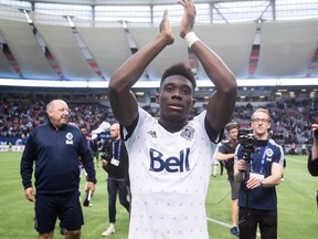 Vancouver Whitecaps midfielder Alphonso Davies salutes the crowd after playing his final match as a member of the MLS soccer team, in Vancouver, on Sunday October 28, 2018.