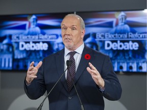 Premier John Horgan speaks after a televised debate on electoral reform.