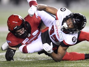 Ottawa Redblacks wide receiver Diontae Spencer (85) fumbles the ball as Calgary Stampeders linebacker Riley Jones (52) looks on during the second half of the 106th Grey Cup at Commonwealth Stadium in Edmonton, Sunday, November 25, 2018.