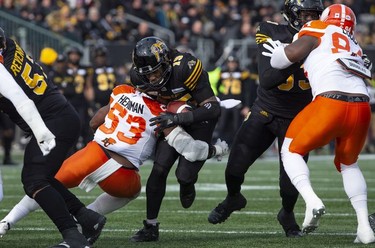 Hamilton Tiger-Cats running back Alex Green (15) is stopped short of the end zone by B.C. Lions linebacker Jordan Herdman (53) during first half CFL Football division semifinal game action in Hamilton, Ont. on Sunday, November 11, 2018.