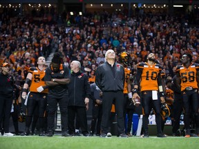 B.C. Lions head coach Wally Buono, centre, will be finished with the CFL club once the playoffs are over. He says it's time for him to move on and for owner David Braley to sell.