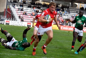 Canada's Theo Sauder runs to score a try during the 2019 Rugby Union World Cup qualifying match between Canada and Kenya at The Delort Stadium in Marseille on November 11, 2018.