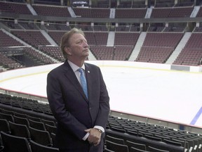 Ottawa Senators owner Eugene Melnyk stands near the ice as members of the media are given a tour of changes to the Canadian Tire Centre in Ottawa on September 7, 2017.