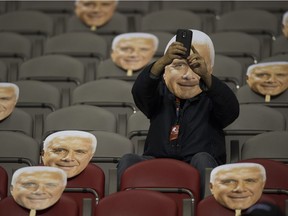 A fan takes a selfie with a Wally Buono mask as the B.C. Lions prepare to host the Calgary Stampeders in the veteran head coach's farewell to B.C. Place in the Leos' final regular-season game.