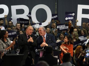 Premier John Horgan and B.C. Green Party leader Andrew Weaver following their speeches at a rally in support of Proportional Representation to help kick off the voting period for the referendum for electoral reform at the Victoria Conference Centre in Victoria, B.C., on Tuesday, October 23, 2018.