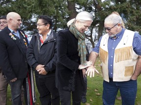 Minister of Environment and Climate Change Catherine McKenna speaks with Chief David Walkem of the Cook's Ferry Indian Band following an announcement in Sidney, B.C. Tuesday, Nov., 13, 2018. McKenna announced that 28 Indigenous projects have been selected as a part of the Indigenous Guardians Pilot Program.