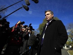 CNN's Jim Acosta speaks to journalists on the North Lawn upon returning back to the White House in Washington, Friday, Nov. 16, 2018. U.S. District Court Judge Timothy Kelly ordered the White House to immediately return Acosta's credentials. He found that Acosta was "irreparably harmed" and dismissed the government's argument that CNN could send another reporter in Acosta's place to cover the White House.