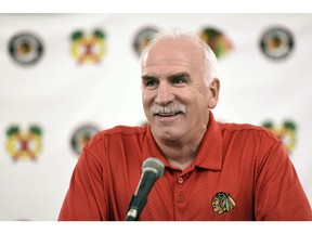 FILE - In this July 21, 2017 file photo, Chicago Blackhawks' head coach Joel Quenneville speaks at a news conference during the NHL hockey team's convention in Chicago. The Blackhawks have fired the three-time Stanley Cup winning coach. General manager Stan Bowman announced the startling dismissal of Quenneville and assistants Kevin Dineen and Ulf Samuelsson on Tuesday, Nov. 6, 2018, and appointed Jeremy Colliton the new coach. Chicago was off to a 6-6-3 start and missed the playoffs last season.