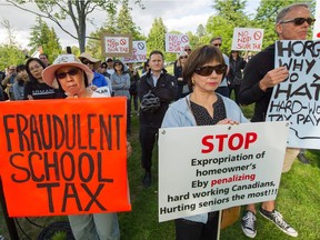 Homeowners against the additional school tax rallied earlier this year in Vancouver.