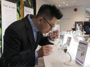 Michael Tan, Executive Director of Cannabis, demonstrates how a customer would use a sniffer at the BC Cannabis Store in Kamloops, BC, October, 17, 2018.