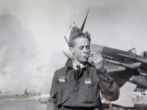 Handout photo of Big Al Davidson smoking a cigar on the bomb. Nice shot of a Typhoon right behind him.