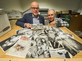 Editor-in-Chief Harold Munro and reporter John Mackie look over archival photos from The Province's Empty Stocking Fund.