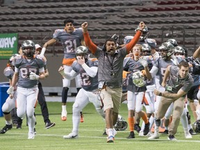 New West Hyacks head coach Farhan Lalji celebrates with his team after the Hyaks scored a touchdown on the final play of the game against the Terry Fox Ravens during the BC High School AAA Football Championships at B.C. Place on Dec. 2, 2017. The two sides will meet up in the semifinals this season.