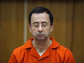 Former USA Gymnastics team doctor Larry Nassar listens during his sentencing at Eaton County Circuit Court in Charlotte, Mich., on Feb. 5, 2018. The U.S. Olympic Committee is moving to revoke USA Gymnastics' status as the governing body for the sport at the Olympic level.
