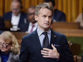 Minister of Veterans Affairs Seamus O'Regan rises during question period in the House of Commons on Parliament Hill in Ottawa on Thursday, Sept. 27, 2018. The federal government says it shortchanged hundreds of thousands of veterans and their survivors over seven years, and is preparing to compensate them a total of $165 million.