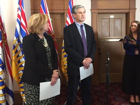 Liberal house leader Mary Polak and Liberal Leader Andrew Wilkinson speak at the B.C. legislature on Thursday.