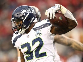 Chris Carson of the Seattle Seahawks rushes with the ball against the San Francisco 49ers during their NFL game at Levi's Stadium on December 16, 2018 in Santa Clara, California.