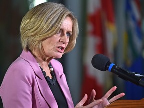 Premier Rachel Notley speaks at a news conference where she announced moves to restrict oilsands production in face of oil price crisis, at the Federal Building in Edmonton on Sunday, Dec. 2, 2018.