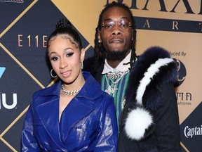 FILE- In this Feb. 3, 2018, file photo, Cardi B, left, and Offset arrive at the Maxim Super Bowl Party at the Maxim Dome in Minneapolis. A marriage certificate shows hip-hop stars Cardi B and the Migos' Offset were married months ago in Atlanta. Cardi B confirmed the marriage in a tweet Monday.