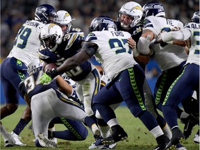 Seahawks DL Poona Ford tracks Detrez Newsome of the Los Angeles Chargers in a preseason game on Aug. 18. He went undrafted but has managed to work his way onto the Seattle active roster late in the regular season.