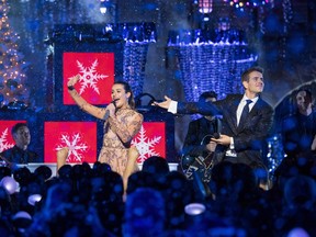 In this handout photo provided by Disney Parks, Lea Michele and Joey McIntyre of NKOTB perform "Baby, It's Cold Outside" during a taping of "The Wonderful World of Disney