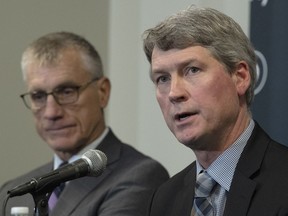 New Philadelphia Flyers NHL hockey team general manager Chuck Fletcher speaks to the media as team president Paul Holmgren looks on during a press conference at the Flyers practice facility in Voorhees, N.J., Wednesday, Dec. 5, 2018.