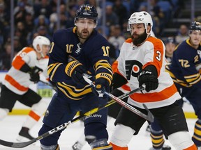 Buffalo Sabres forward Patrik Berglund (10) and Philadelphia Flyers defenseman Radko Gates (3) battle for the puck during the first period of an NHL hockey game, Saturday, Dec. 8, 2018, in Buffalo N.Y.