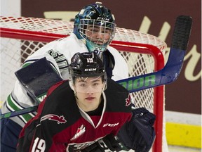 Seattle Thunderbirds goalie Liam Hughes tries to clear Vancouver Giants Dawson Holt from in front of the net during a game at the LEC earlier this year. When Holt and the Giants return from the Christmas break they will play 23 of their last 36 games on the road.
