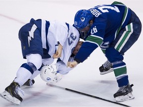 Antoine Roussel fights with Tampa Bay Lightning centre Yanni Gourde during the second period.