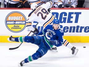 Vancouver Canucks' Jake Virtanen, front, loses his balance and falls after avoiding a collision with Edmonton Oilers' Leon Draisaitl, of Germany, during second period NHL hockey action in Vancouver on Sunday, Dec. 16, 2018.